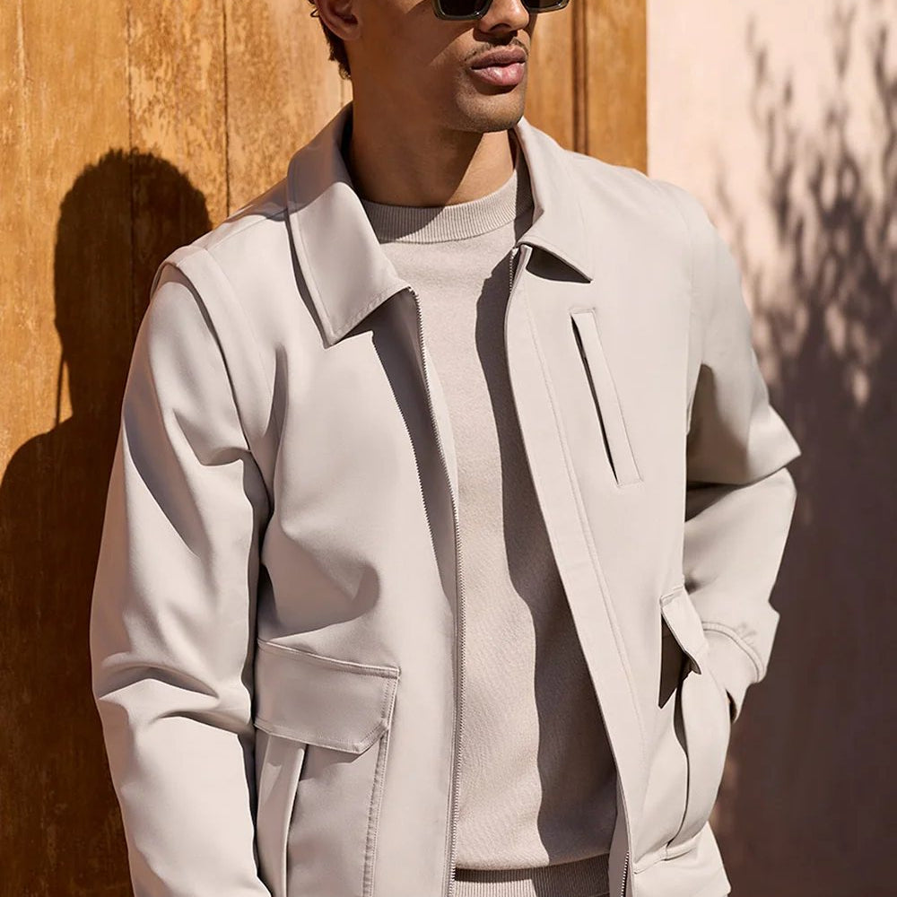 Man wearing Celuna Olive square sunglasses with a stone zip jacket
