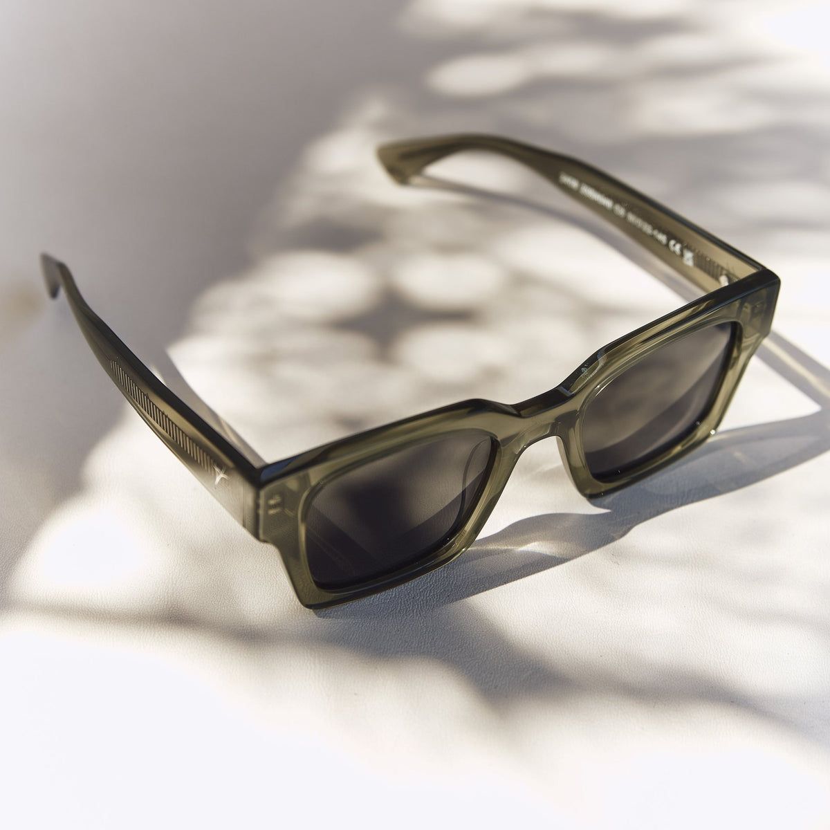 Celuna Olive sunglasses, square olive acetate frame, front view in sunlight