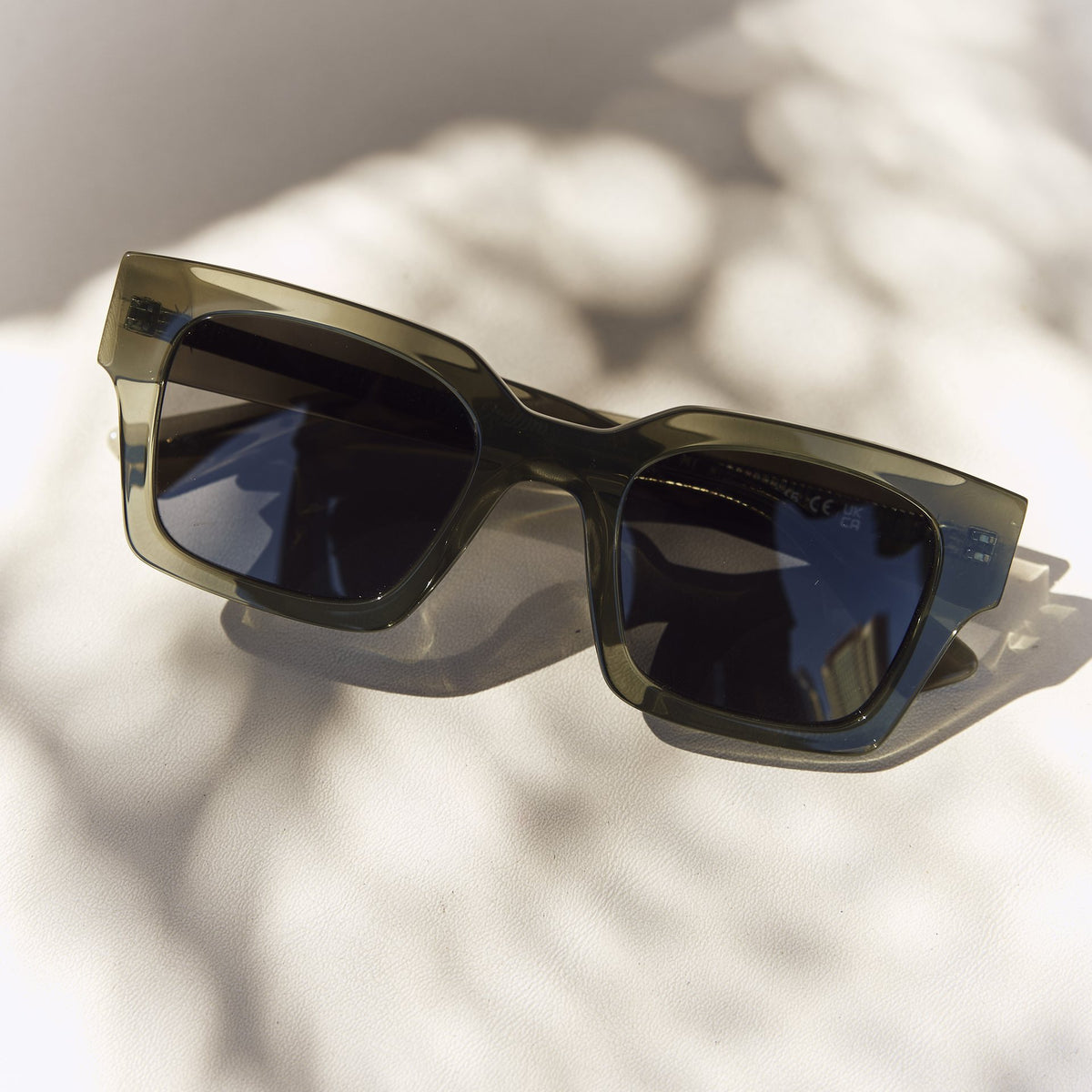 Celuna Olive sunglasses with dark lenses, angled view