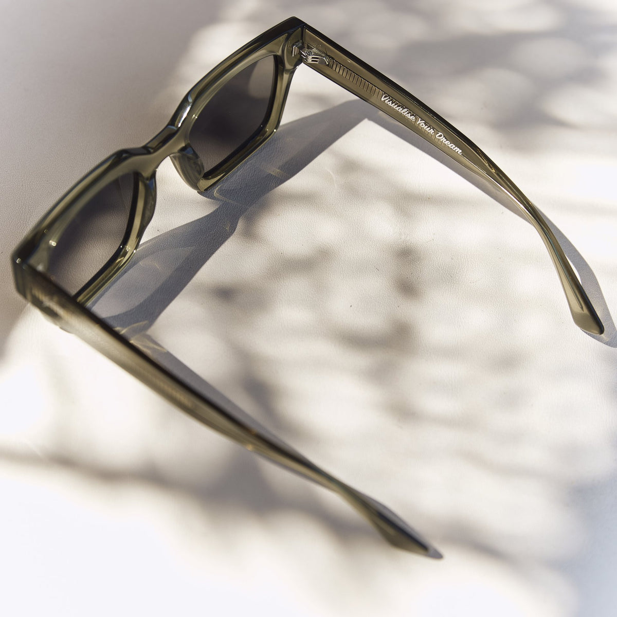 Celuna Olive sunglasses, open arms, three-quarter view