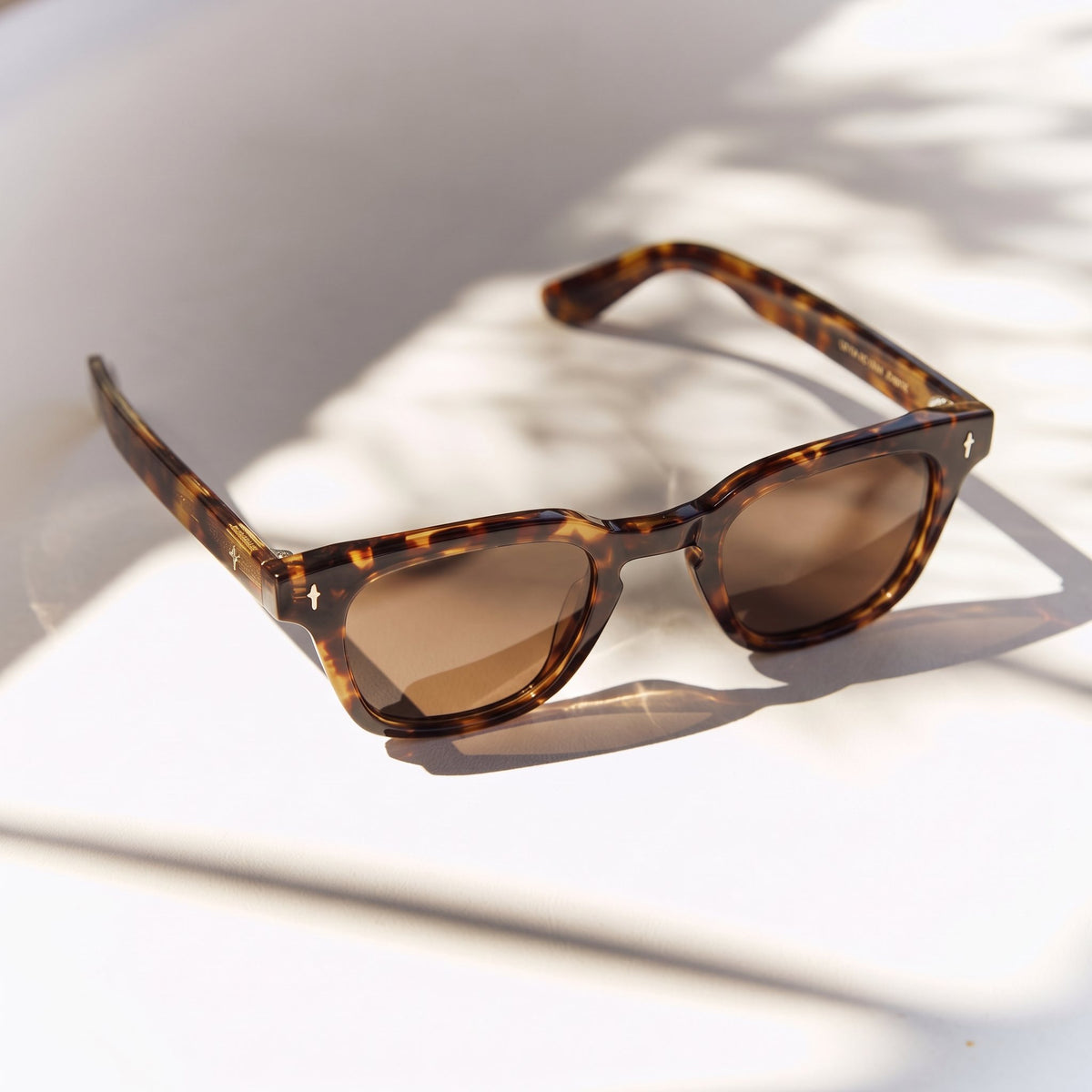 Noema Tortoiseshell sunglasses with brown lenses and star rivets