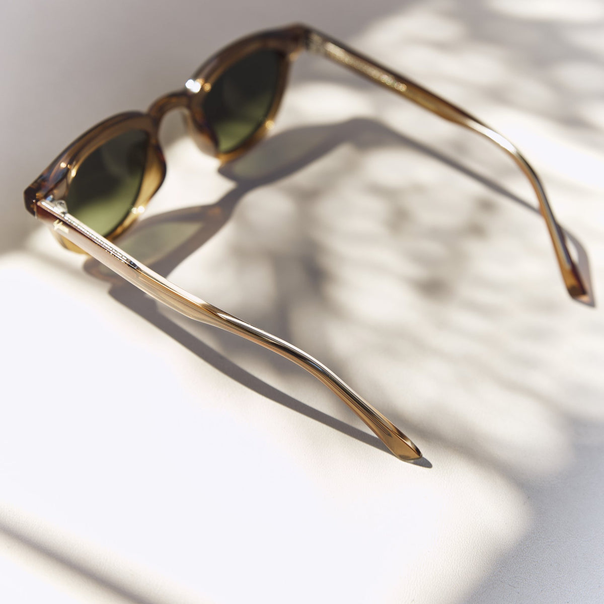 Noxie Brown/Green sunglasses, side view with open arms