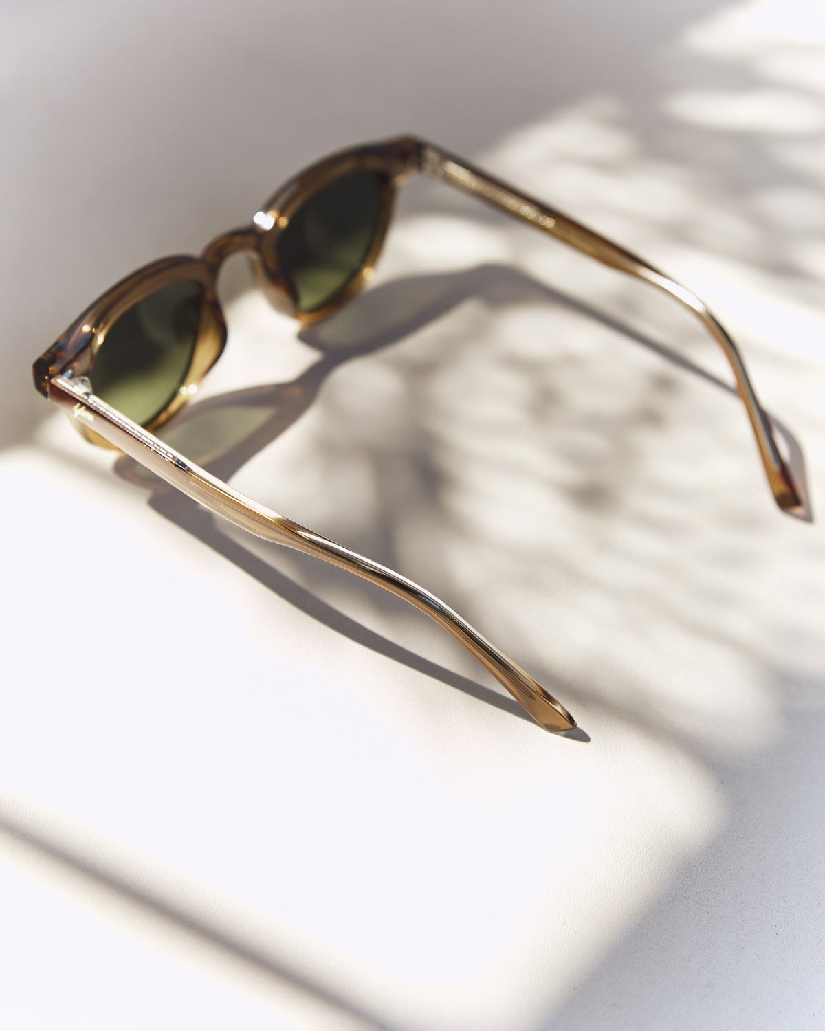 Noxie Brown/Green sunglasses, side view with open arms