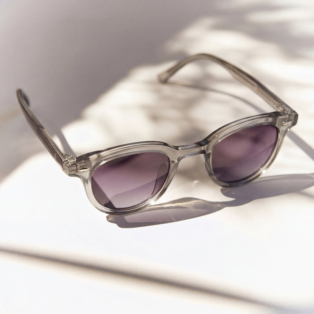 Noxie Grey/Purple sunglasses, clear grey frame with purple gradient lenses