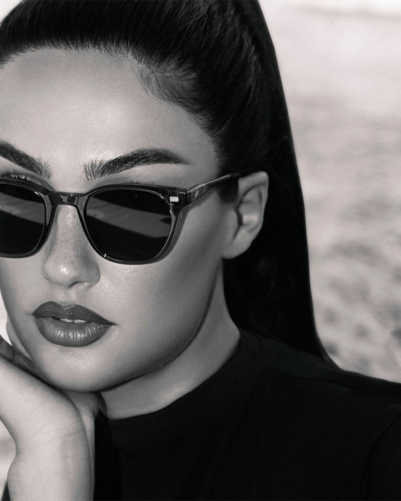 Lucid sunglasses styled for evening drinks