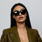 Woman wearing Yume Celuna Tortoiseshell sunglasses