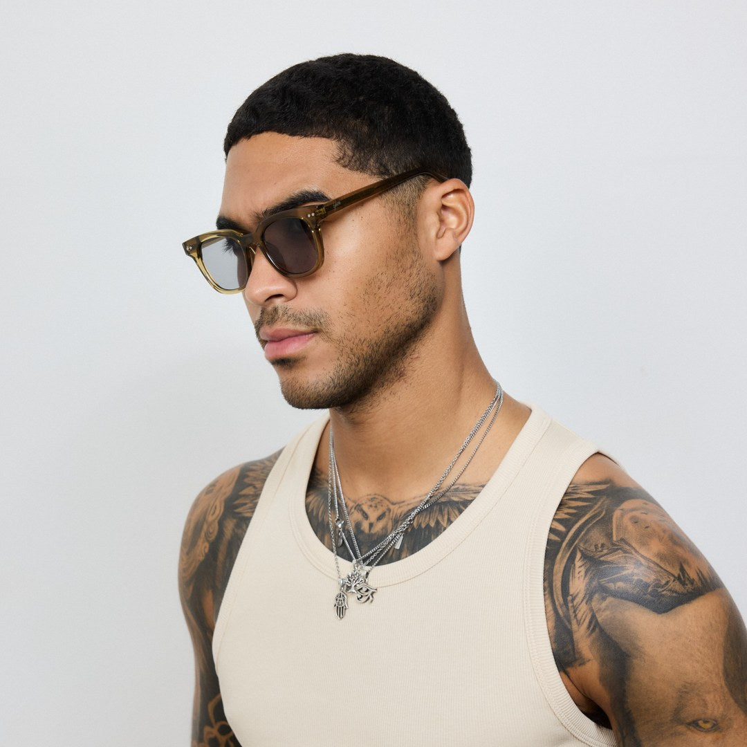 Man wearing Yume Velora Desert Green Gold sunglasses