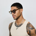 Man wearing Yume Velora Desert Green Gold sunglasses