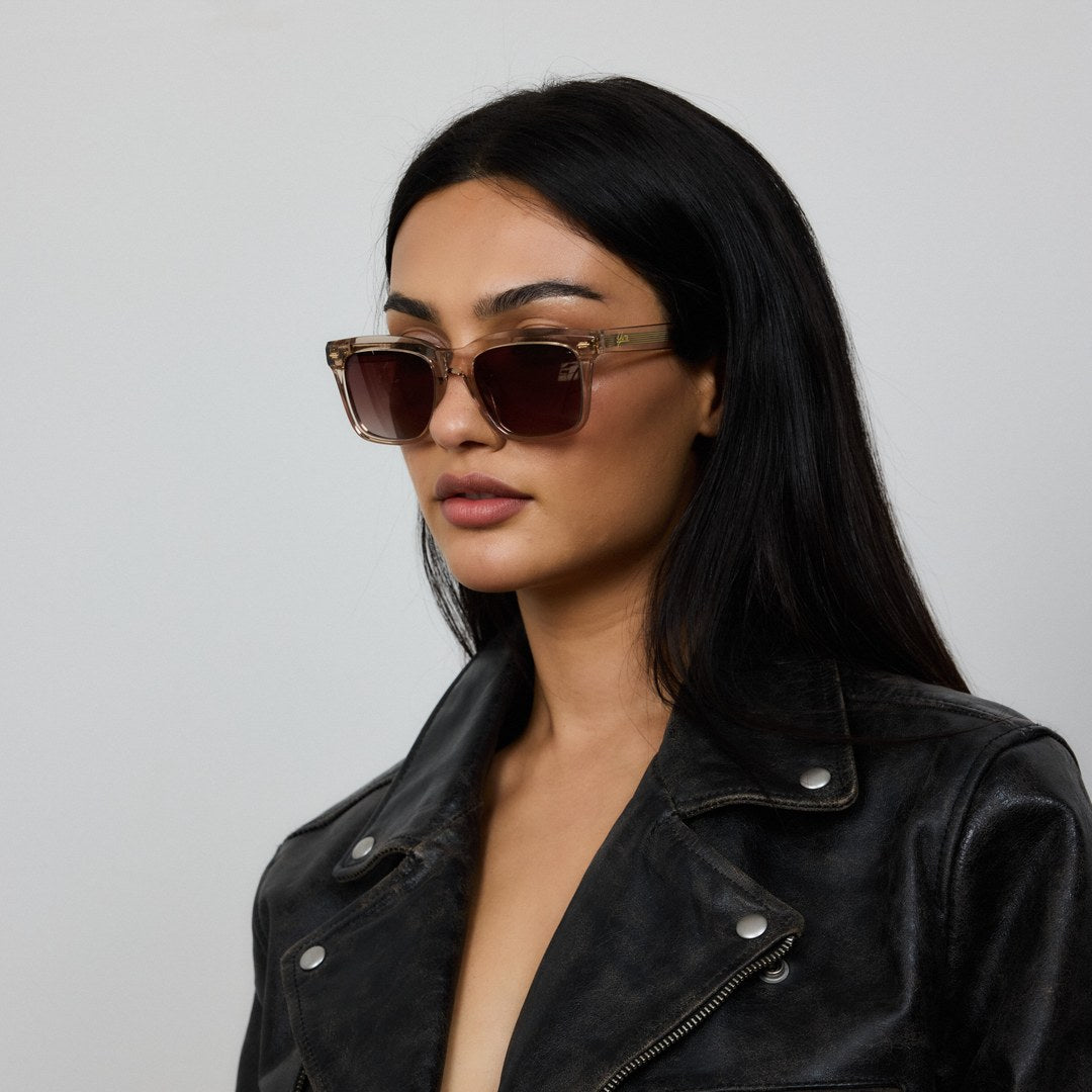 Woman wearing Yume Somnia Champagne Gold sunglasses