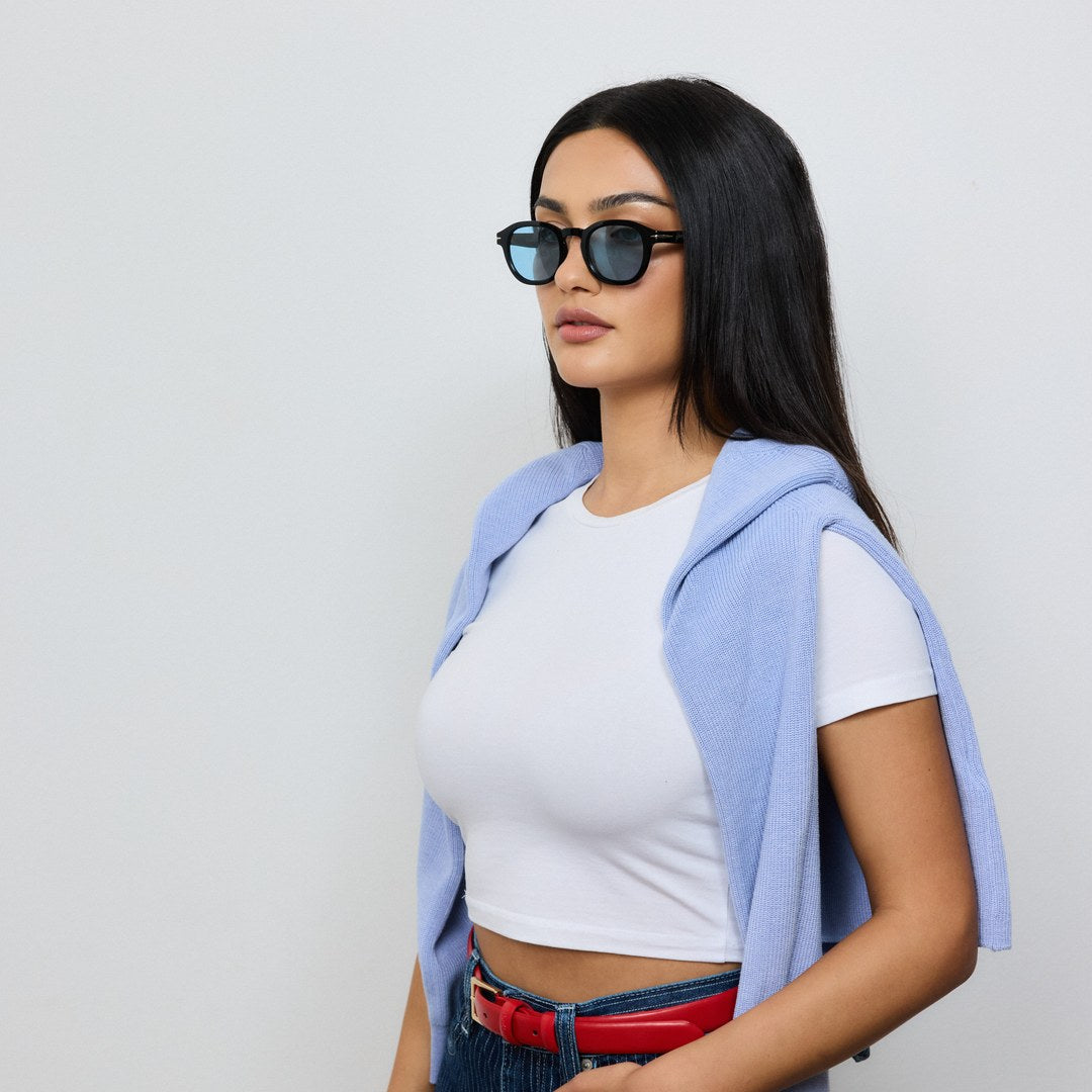 Woman wearing Yume Mirae Black/Blue sunglasses