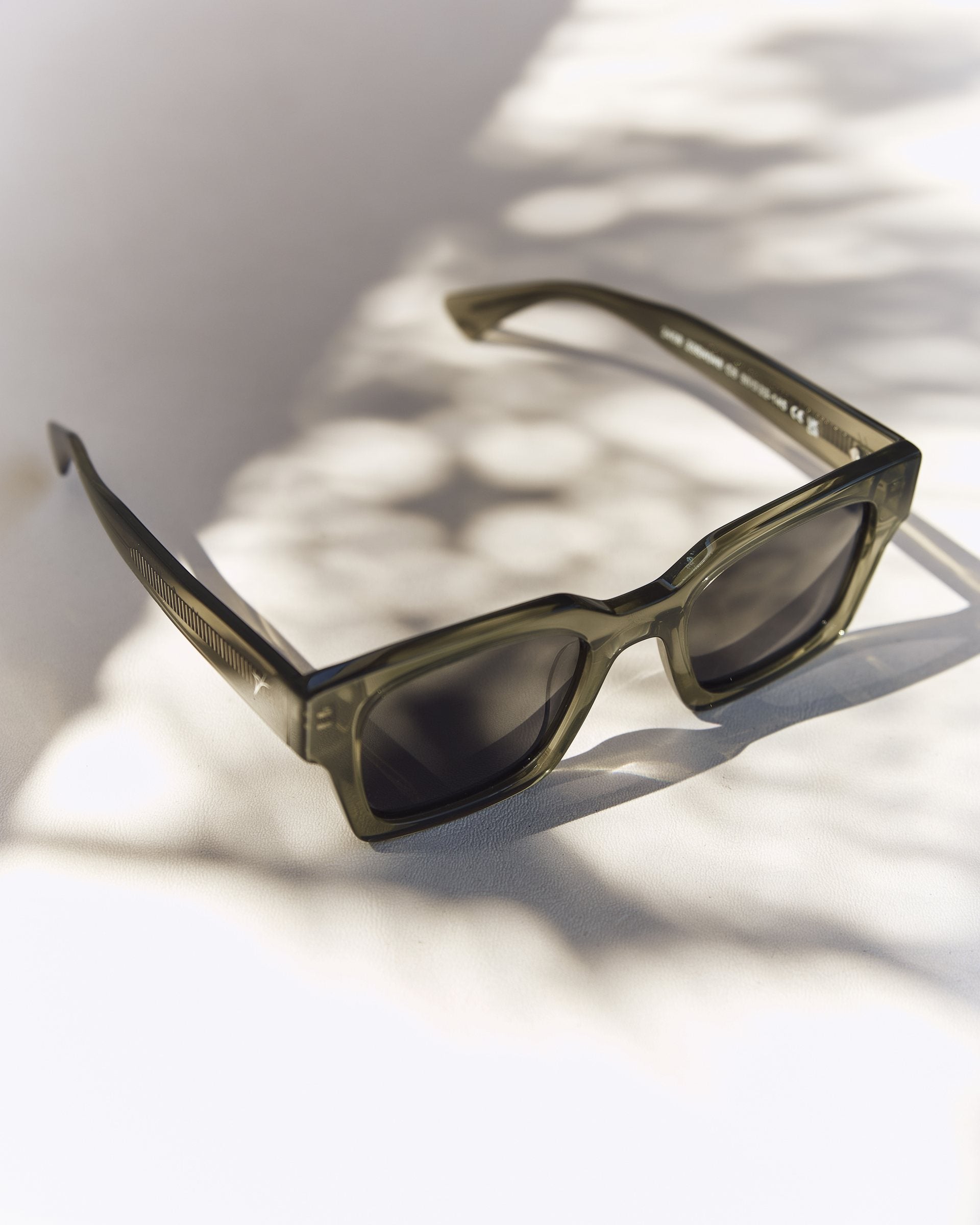 Celuna Olive sunglasses, square olive acetate frame, front view in sunlight