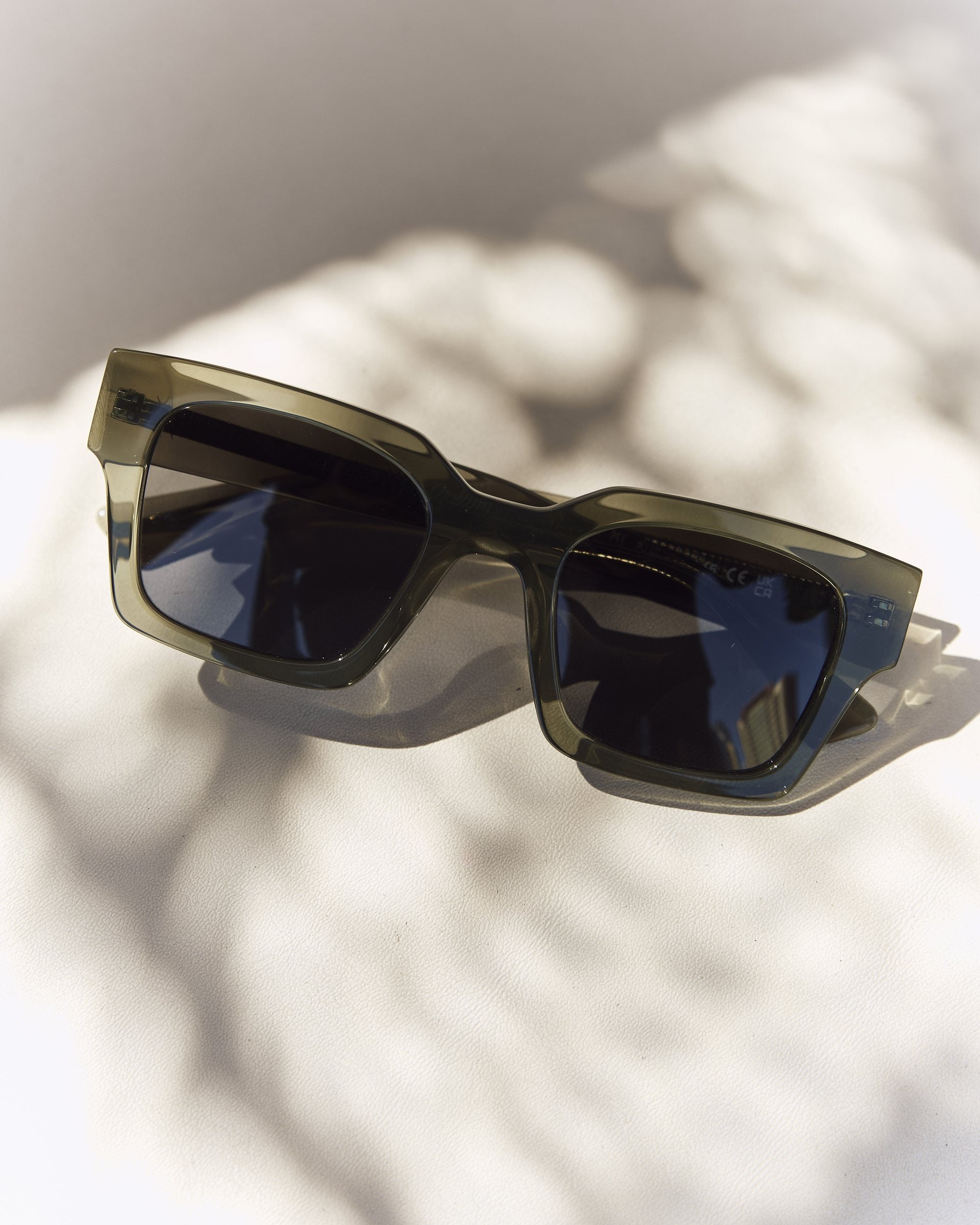 Celuna Olive sunglasses with dark lenses, angled view