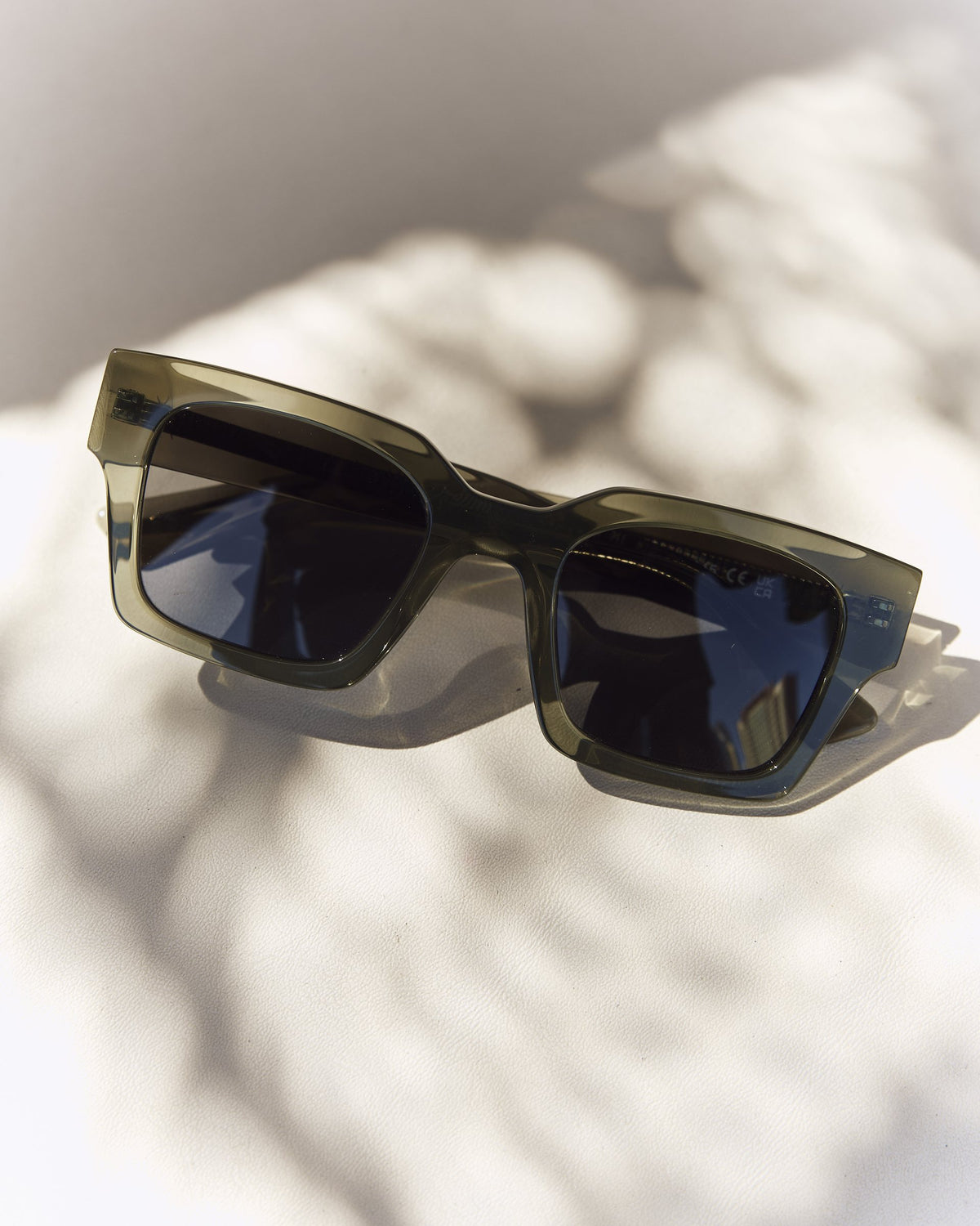 Celuna Olive sunglasses with dark lenses, angled view