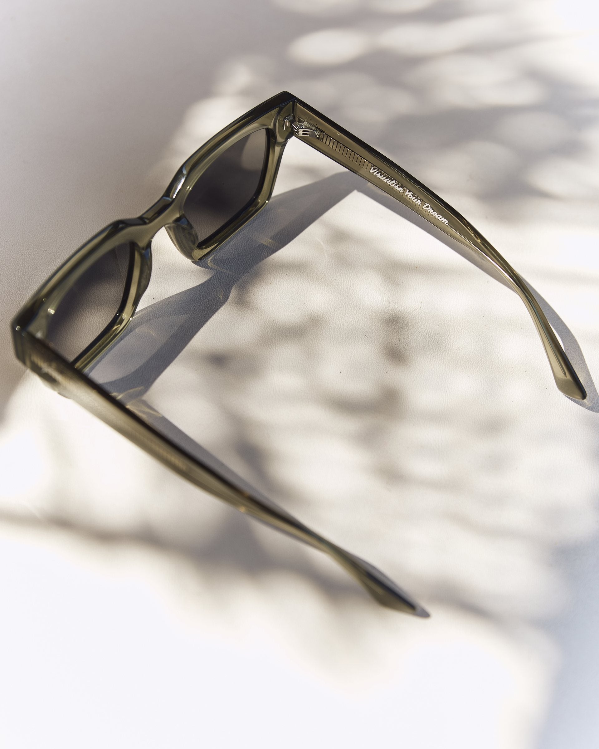 Celuna Olive sunglasses, open arms, three-quarter view