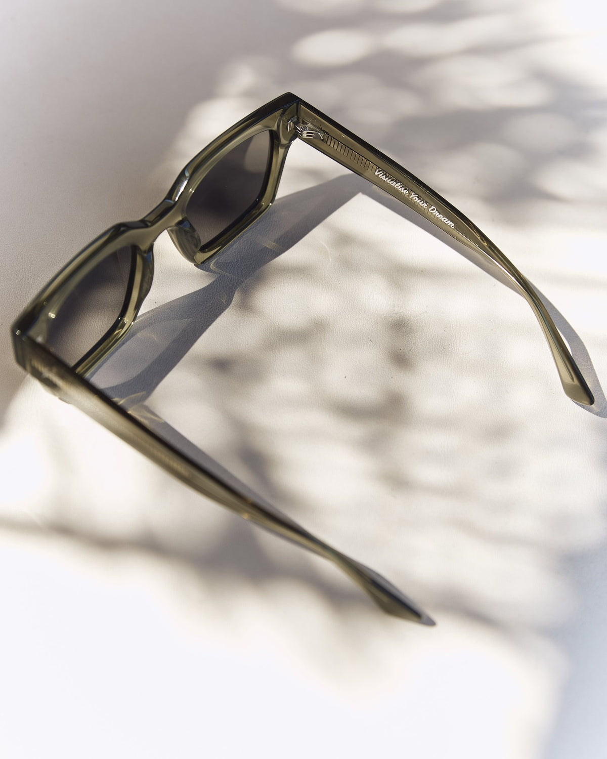 Celuna Olive sunglasses, open arms, three-quarter view