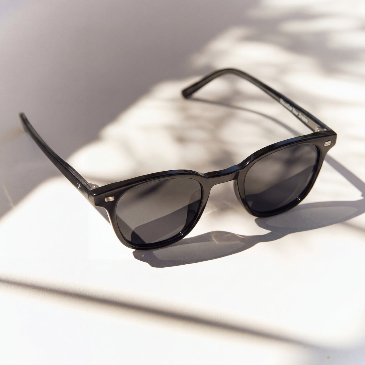 Lucid Black sunglasses, glossy black frame with grey lenses