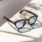 Mirae Black/Blue sunglasses, black round frame with light blue lenses