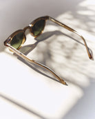 Noxie Brown/Green sunglasses, side view with open arms